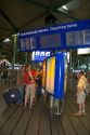 People buy tickets for the train in the terminal at Schiphol Airport in Amsterdam, Netherlands.
