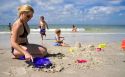 Family plays at the beach in St. Petersburg, Florida. MR
