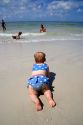 Infant crawling on the beach in St. Petersburg, Florida. MR