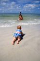 Infant crawling on the beach at St. Petersburg, Florida. MR