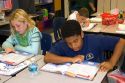Fouth grade students read textbooks in a classroom at a public school in Tampa, Florida.