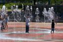 Children play in the Fountain of Rings in Centennial Olympic Park, Atlanta, Georgia.