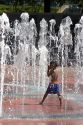 A child plays in the Fountain of Rings in Centennial Olympic Park, Atlanta, Georgia.