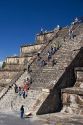 Tourists climb the steps of the Pyramid of the Moon at Teotihuacan in the State of Mexico, Mexico.