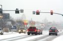Traffic at a stop light on a snowy day in Boise, Idaho.