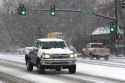 Automobiles driving on a snowy day in Boise, Idaho.