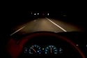 Dashboard lights while driving at night.