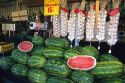 Farmers market selling watermelon and garlic in California.