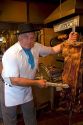 Argentine man cooking beef at a restaurant in Buenos Aires, Argentina.