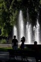 People in front of a water fountain in Plaza Independencia in Mendoza, Argentina.