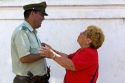 Woman greeting a Chilean police officer at Valparaiso, Chile.