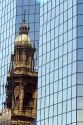 Reflection of the Metropolitan Cathedral in a modern office building in the Plaza de Armas in Santiago, Chile.