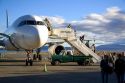 Passengers disembark an airplane at the El Calafate International Airport in Patagonia, Argentina.
