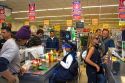 Customers in the check out line of a super market in El Calafate, Patagonia, Argentina.