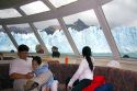 Family on a tour boat at the Perito Moreno Glacier located in the Los Glaciares National Park in the south west of Santa Cruz province, Patagonia, Argentina.