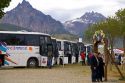 Tourists exit tour buses at Ushuaia on the island of Tierra del Fuego, Argentina.