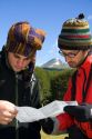 Hikers from Israel look at a map in the Tierra del Fuego National Park, Argentina. MR