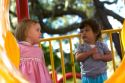 Young girls on playground equipment in Tampa, Florida.