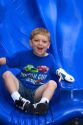 3 year old boy plays on playground equipment at a park in Tampa, Florida. MR