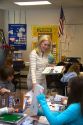 Female fourth grade teacher with students in a classroom in Tampa, Florida.