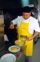 Chef dishing pasta in a restaurant at Salerno, Campania, Italy.