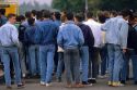 Italians teens wearing denim jeans and jackets at Verona, Italy.
