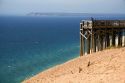 People stand on a viewing platform on the banks of Lake Michigan in Sleeping Bear Dunes National Lakeshore located along the northwest coast of the Lower Peninsula of Michigan.