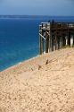 People stand on a viewing platform on the banks of Lake Michigan in Sleeping Bear Dunes National Lakeshore located along the northwest coast of the Lower Peninsula of Michigan.