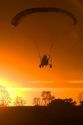 Powered parachute flying at sunset in Eaton County, Michigan.