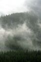 Fog and mist cover the Cascade Range near Snoqualmie Pass in Washington.