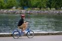 Asian boy riding a bicycle at Stanley Park in Vancouver, British Columbia, Canada.