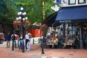 People dine at a sidewalk cafe in the Gastown area of Vancouver, British Columbia, Canada.