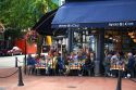 People dine at an outdoor cafe in the Gastown area of Vancouver, British Columbia, Canada.