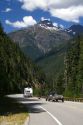 Camper, motorcylce and truck pulling a boat on Washington State Highway 20 in the North Cascade Range, Washington.