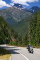 Motorcycle traveling on Washington State Highway 20 in the North Cascade Range, Washington.