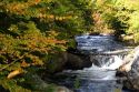 Small stream and autumn colors in Merrimack County, New Hampshire, USA.