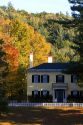 Residential home and fall foliage in the town of Orford, New Hampshire, USA.