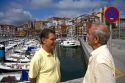 Basque men talk at the fishing port of Bermeo in the province of Biscay, Basque Country, Northern Spain.