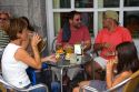 People dine outdoors at a cafe in the town of Lekeitio in the province of Biscay, Basque Country, Northern Spain.