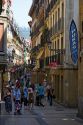 People shopping on a walking street in the city of Donostia-San Sebastian, Basque Country, Northern Spain.