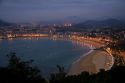 La Concha Bay and the city of Donostia-San Sebastian at dusk, Guipuzcoa, Basque Country, Northern Spain.