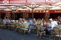 People eating outdoors at a restaurant in the town of Saint-Jean-de-Luz, Pyrenees-Atlantiques, French Basque Country, Southwest France.