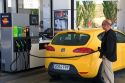 Customer putting fuel in his car at a gas station along the Autopisa near Pamplona, Navarre, northern Spain.