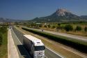 Long haul truck travels along the A-10 Autopista near the town of Etxarri-Aranatz, Navarre, northern Spain.