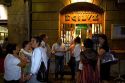 People socialize in front of a tavern in the city of Bilbao, Biscay, Basque Country, northern Spain.
