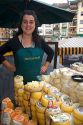 Spanish woman selling cheese at an outdoor market in the town of Cangas de Onis, Asturias, northern Spain.