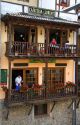 People dine on balconies of a restaurant in the town of Potes, Liebana, Cantabria, northwestern Spain.