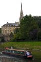 Narrowboat traveling on the River Avon in the city of Bath, Somerset, England.