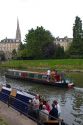 People ride on narrowboats on the River Avon in the city of Bath, Somerset, England.