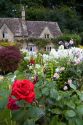 Cotswold stone cottage and garden in the village of Bibury, Gloucestershire, England.